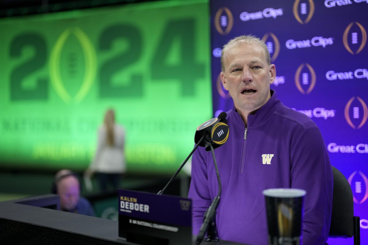 Washington coach Kalen DeBoer speaks to reporters during a news conference on Saturday.