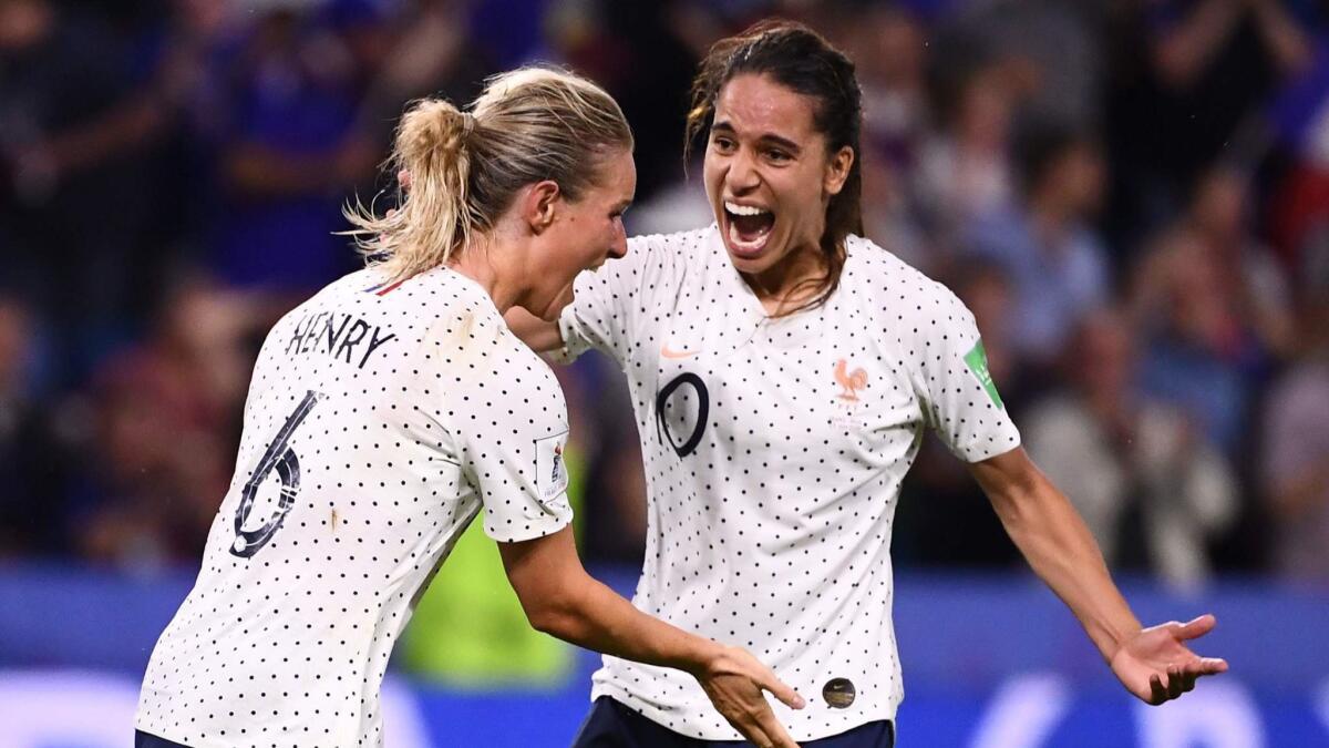 France midfielder Amandine Henry, left, celebrates with teammate Amel Majri after scoring a goal against Brazil in the Women's World Cup on Sunday.