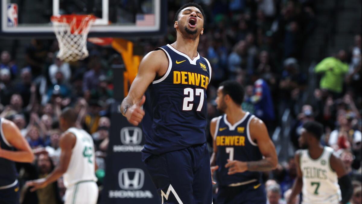 Denver Nuggets guard Jamal Murray reacts after scoring against Boston on Nov. 5.