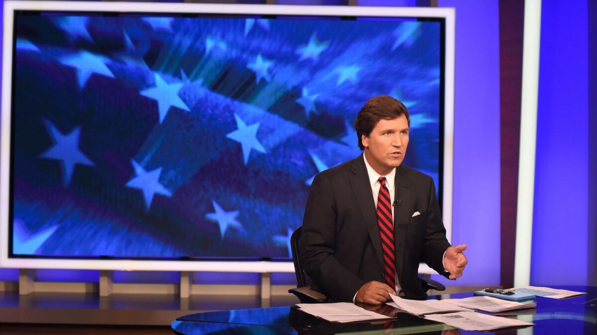 Fox News Channel host Tucker Carlson on the set of his program in New York on Oct. 1, 2018.