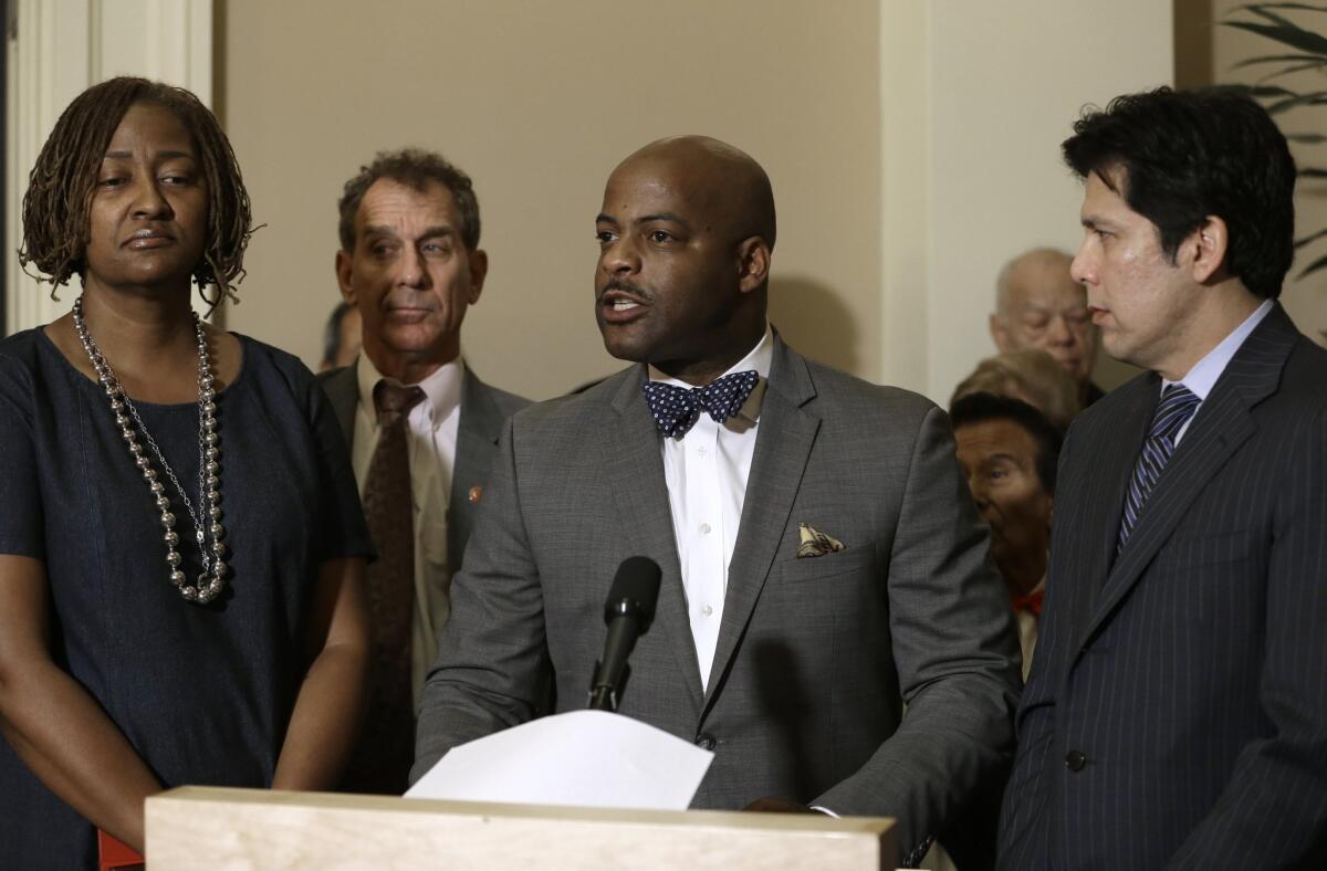 State Sen. Isadore Hall III, center, urged California to divest any business relationships with Donald Trump. Hall was accompanied by Sen. Holly Mitchell, left, Sen. Bob Wieckowski and Senate President Pro Tem Kevin de León.