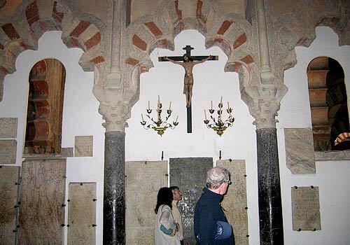 The interior of La Mezquita contains juxtaposed symbols of Christianity and Islam.