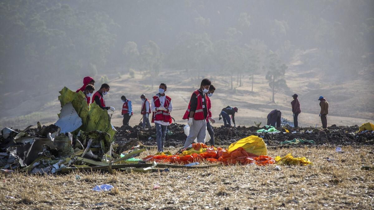 Rescuers work at the scene where an Ethiopian Airlines jet crashed on March 11, 2019.