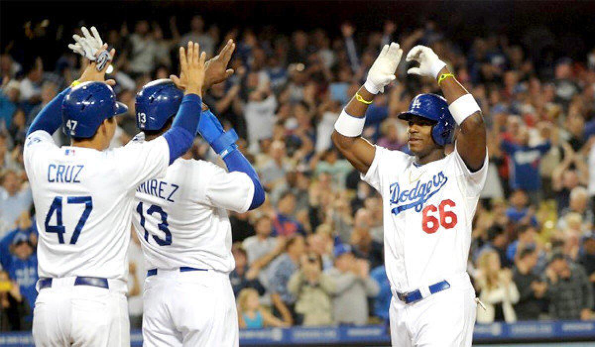 Yasiel Puig's grand slam in the bottom of the eighth inning gave the rookie outfielder his third home run in four games, and cranked the Dodgers to a 5-0 victory over the Atlanta Braves.