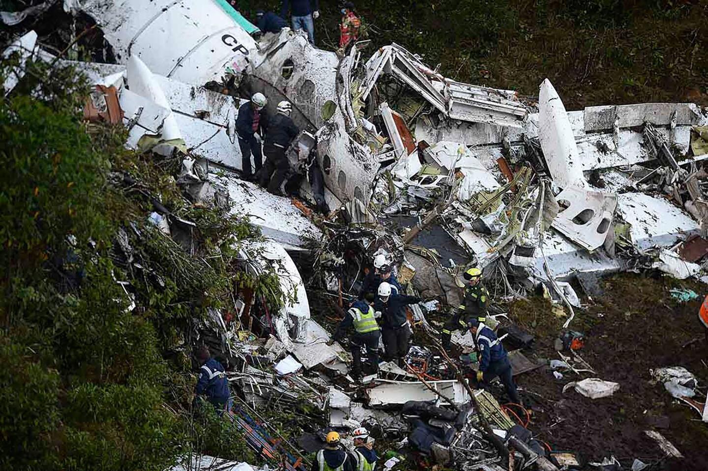Rescuers search for survivors from the wreckage of the LaMia airlines charter plane carrying members of the Chapecoense Real soccer team that crashed in the mountains of Cerro Gordo, in Colombia.
