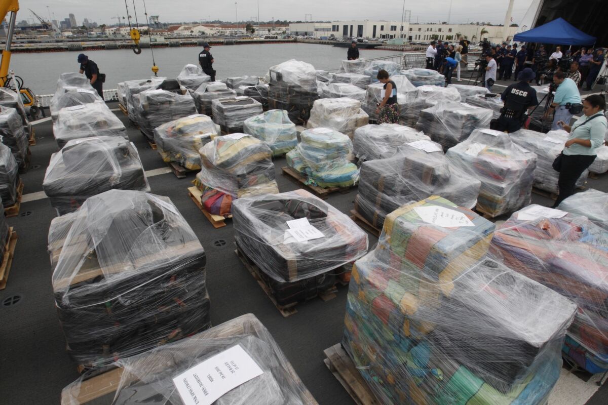 The crew of the U.S. Coast Guard Stratton unloaded 34 tons of cocaine that it brought to San Diego after a four month operation in the Eastern Pacific off the coast of Central and South America. (John Gibbins / San Diego Union-Tribune)