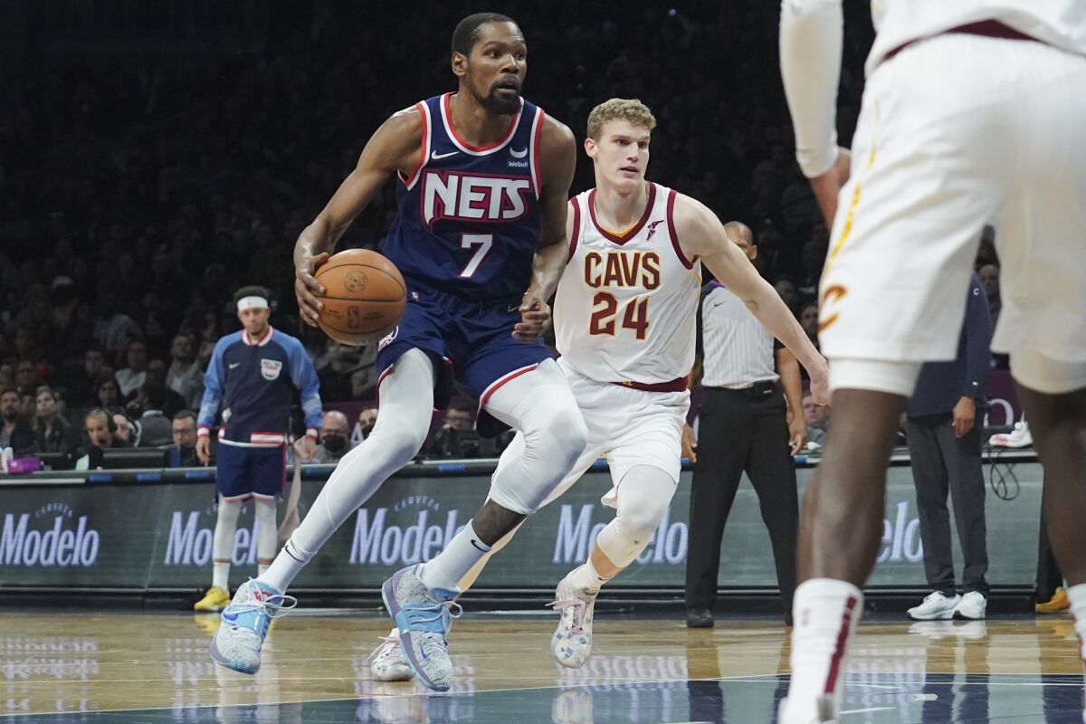 Brooklyn Nets forward Kevin Durant (7) drives to the basket against the Cleveland Cavaliers during the second half of an NBA basketball game Friday April 8, 2022, in New York. (AP Photo/Bebeto Matthews)