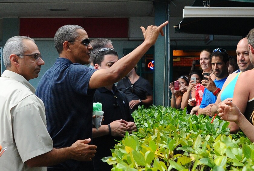 President Obama greets people in Kailua, Hawaii, on New Year's Eve.