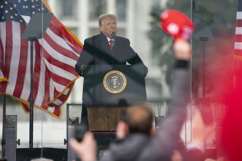 President Donald Trump speaks during a rally protesting the electoral college certification of Joe Biden as president.