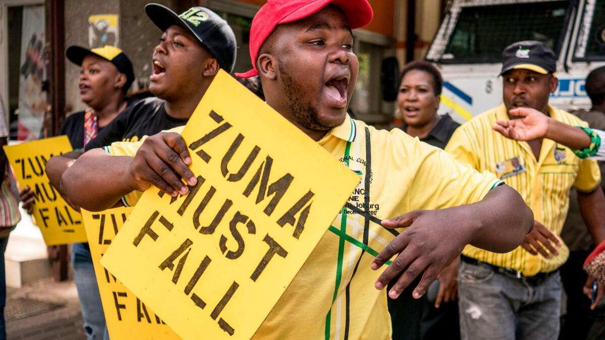 Supporters of the African National Congress Deputy President Cyril Ramaphosa chant slogans outside the ANC party headquarters in Johannesburg, on Feb. 5, 2018, during a demonstration against South African President Jacob Zuma.