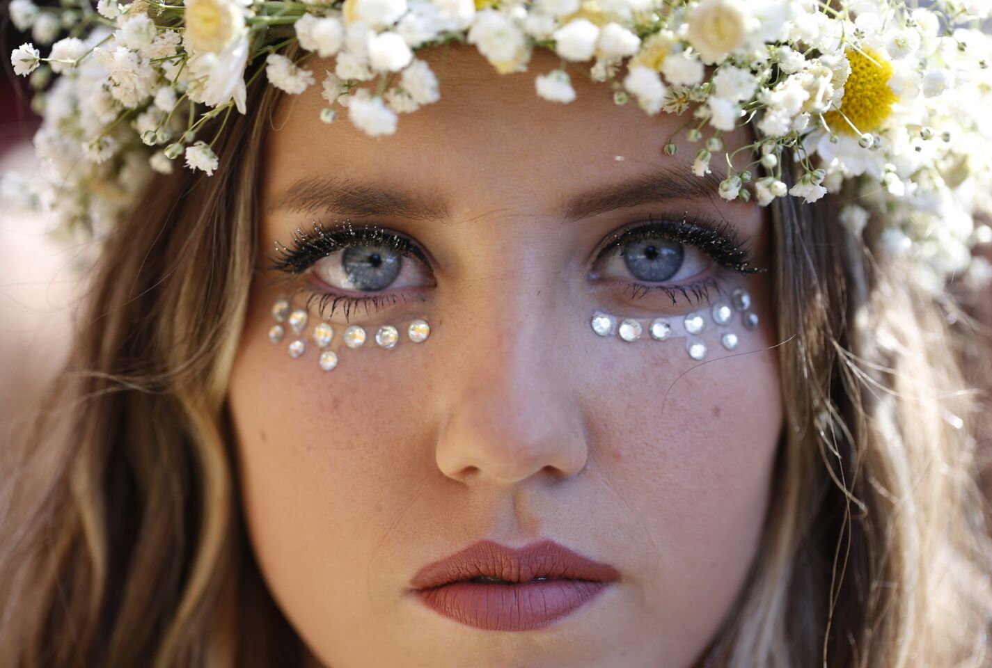 Clarissa Swikard, 18, of San Diego sports jewels and a flower crown to Day Three of the Coachella Valley Music and Arts Festival in Indio.