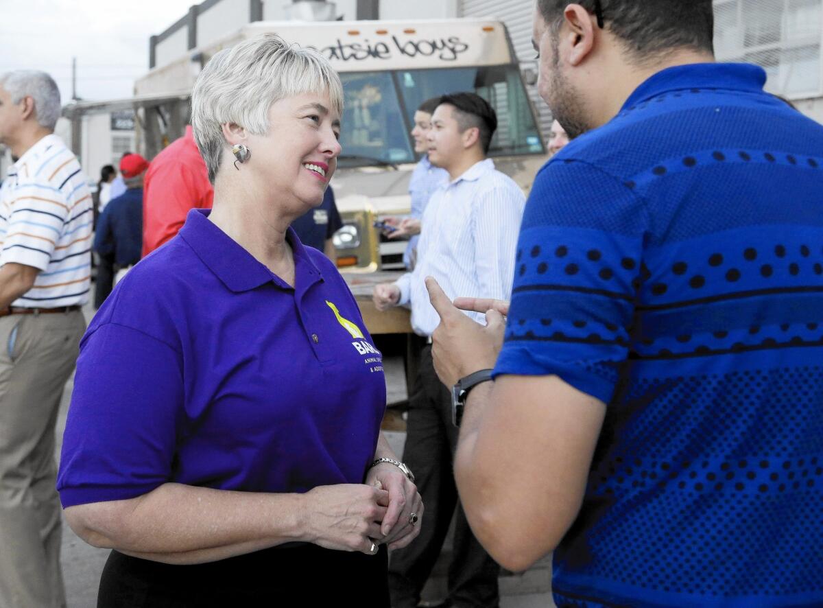 Houston Mayor Annise Parker greets a supporter at a fundraiser for the Houston Equal Rights Ordinance last month. "It is my life that is being discussed.... The debate is about me," she said of the issue last year.