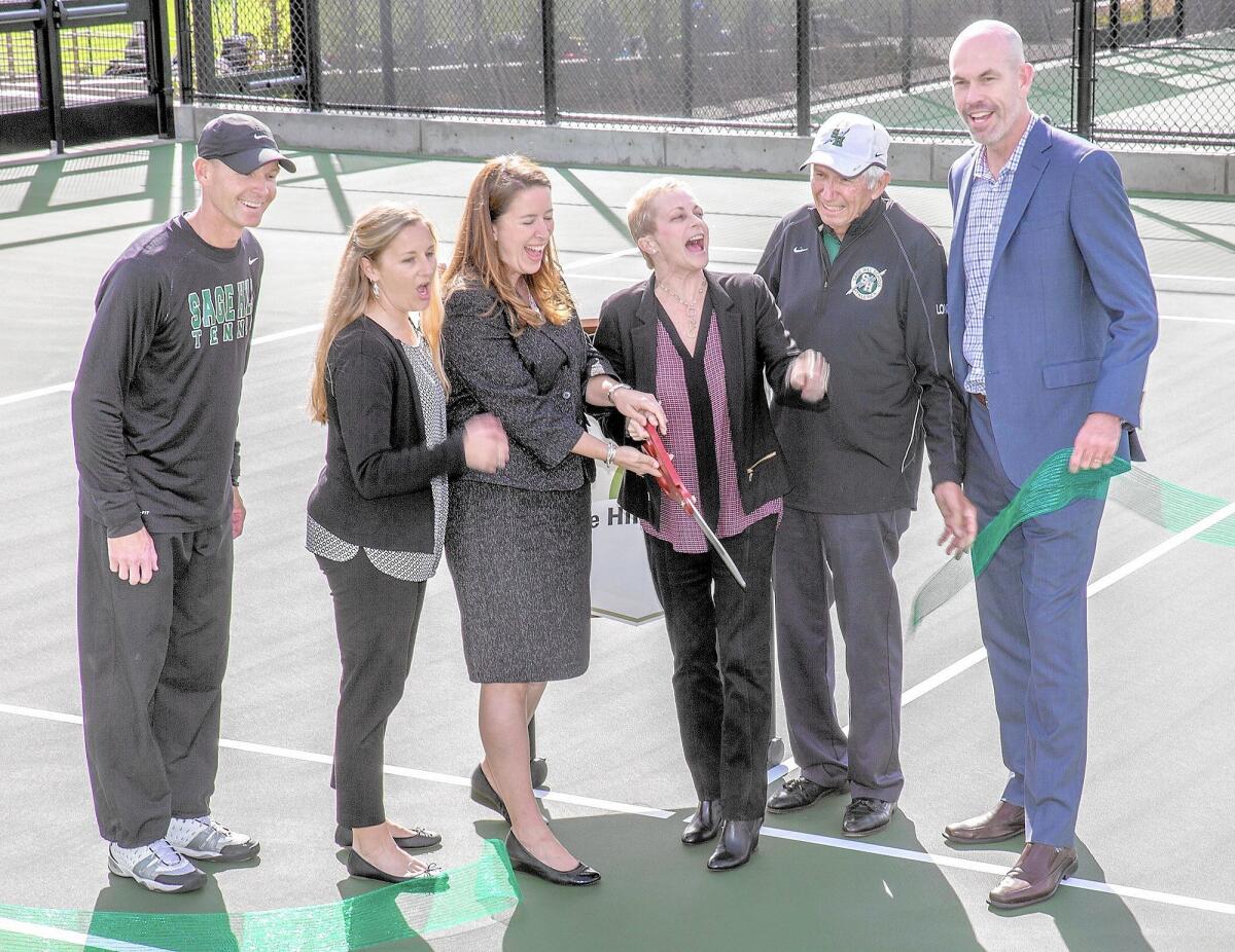 From left, Sage Hill School's head tennis coach Mark Watkins, athletic director Megan Cid, head of school Patricia Merz, chair of the Sage Hill board of trustees Christy Marlin, founding head tennis coach A.G. Longoria and President Gordon McNeill cut the ribbon to celebrate the campus' new Tennis Center.