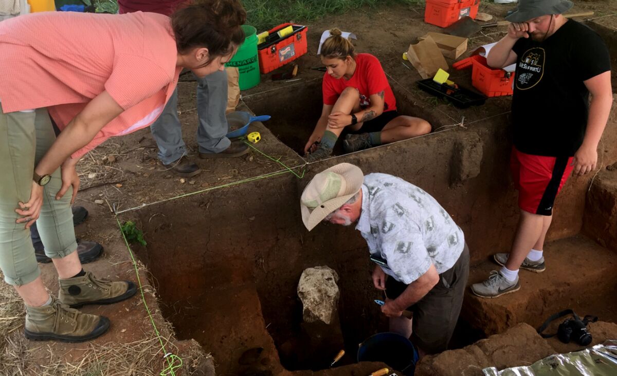 Professor Donald Blakeslee in one of the pits being excavated in Arkansas City, Kan.