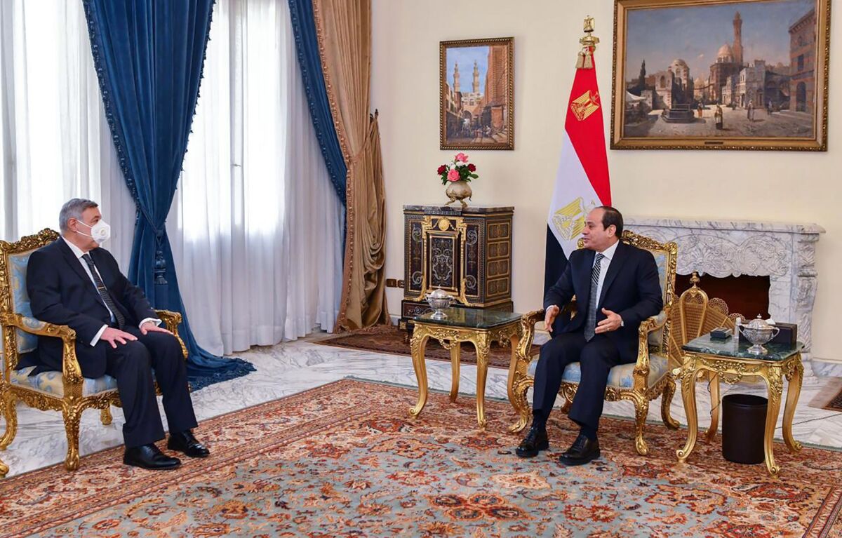 In this photo provided by Egypt's presidency media office, Egyptian President Abdel-Fattah el-Sissi, right, meets with Judge Boulos Fahmy, after he was sworn in as the first-ever Coptic Christian to head the country’s highest court, in Cairo, Egypt, Wednesday, Feb. 9, 2022. The 65-year-old is the 19th person to preside over the Supreme Constitutional Court since it was established in 1969. (Egyptian Presidency Media Office via AP)