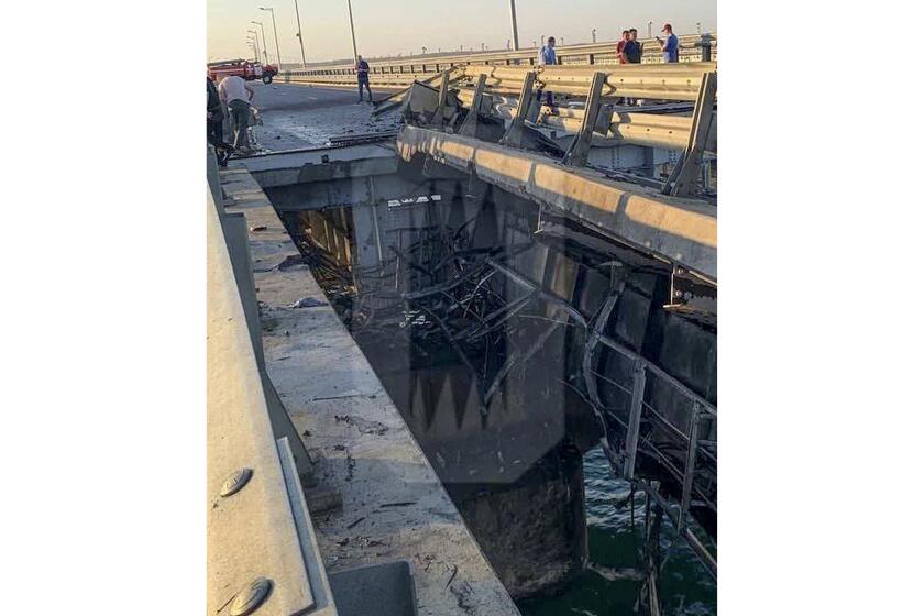 This photo released by Ostorozhno Novosti on Monday, July 17, 2023, reportedly shows damaged parts of an automobile link of the Crimean Bridge connecting Russian mainland and Crimean peninsula over the Kerch Strait not far from Kerch, Crimea. Traffic on the key bridge connecting Crimea to Russia's mainland was halted on Monday, July 17, after reports of explosions that Crimean officials said were from a Ukrainian attack.(Ostorozhno Novosti via AP)