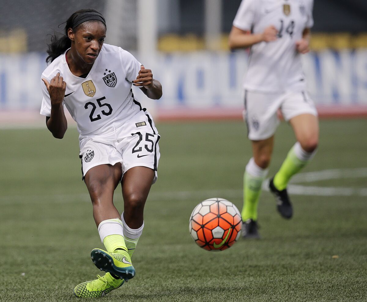 FILE - In this Sept. 20, 2015, file photo, United States' Crystal Dunn passes the ball during the U.S. Women's World Cup victory tour against Haiti in Birmingham, Ala. There was a time, only a few years back really, when just playing the game was enough for Crystal Dunn. (AP Photo/Brynn Anderson, File)