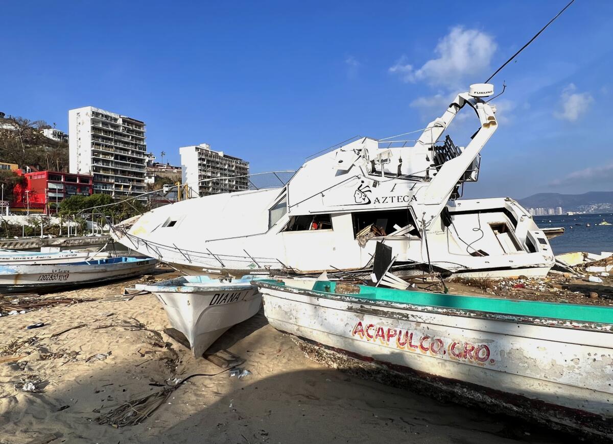 Wrecked boats along the beach in Acapulco following Hurricane Otis.