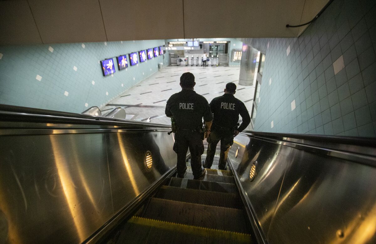 LAPD officers patrol the Hollywood/Highland Metro Station in Hollywood. 