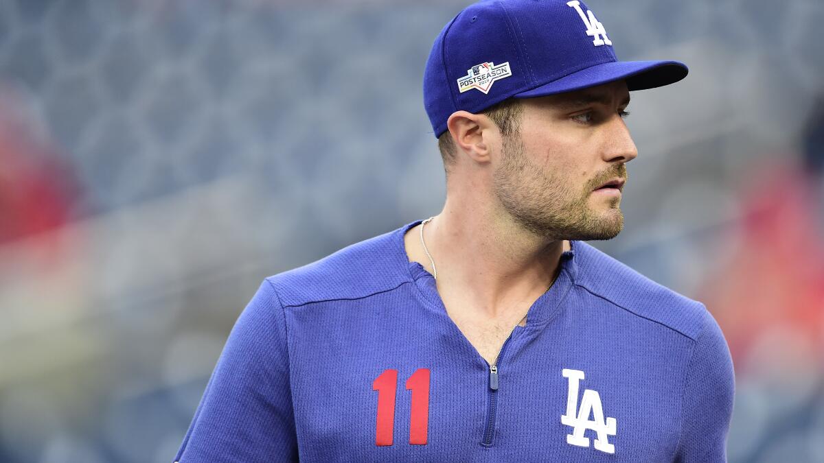 Matt Beaty of the Los Angeles Dodgers is covered by baby powder by