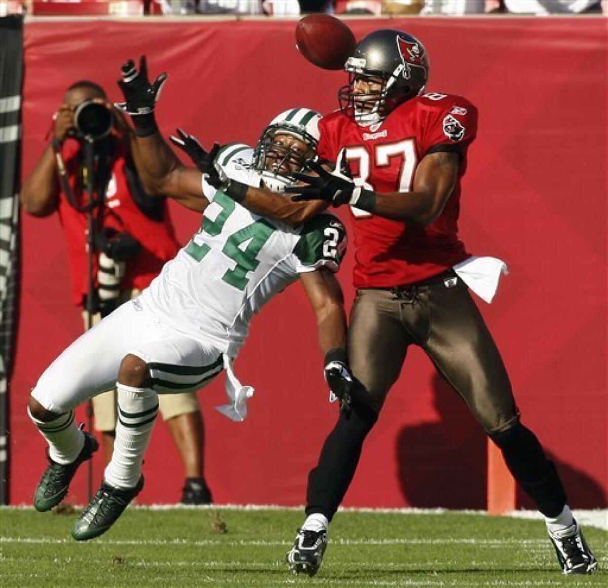 The NFL's Defensive Player of the Year -- is it Charles Woodson, or Darrelle  Revis? 