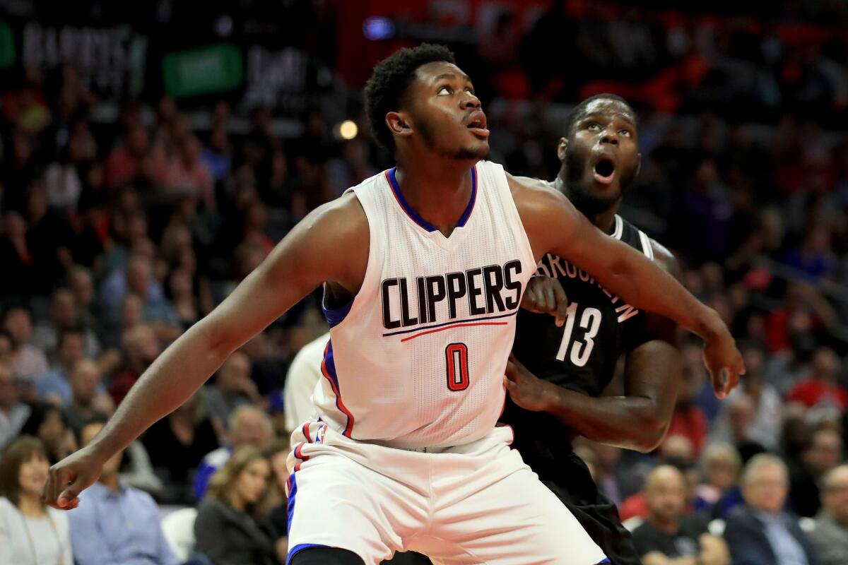 Clippers' Diamond Stone blocks out Brooklyn's Anthony Bennett on Nov. 14.