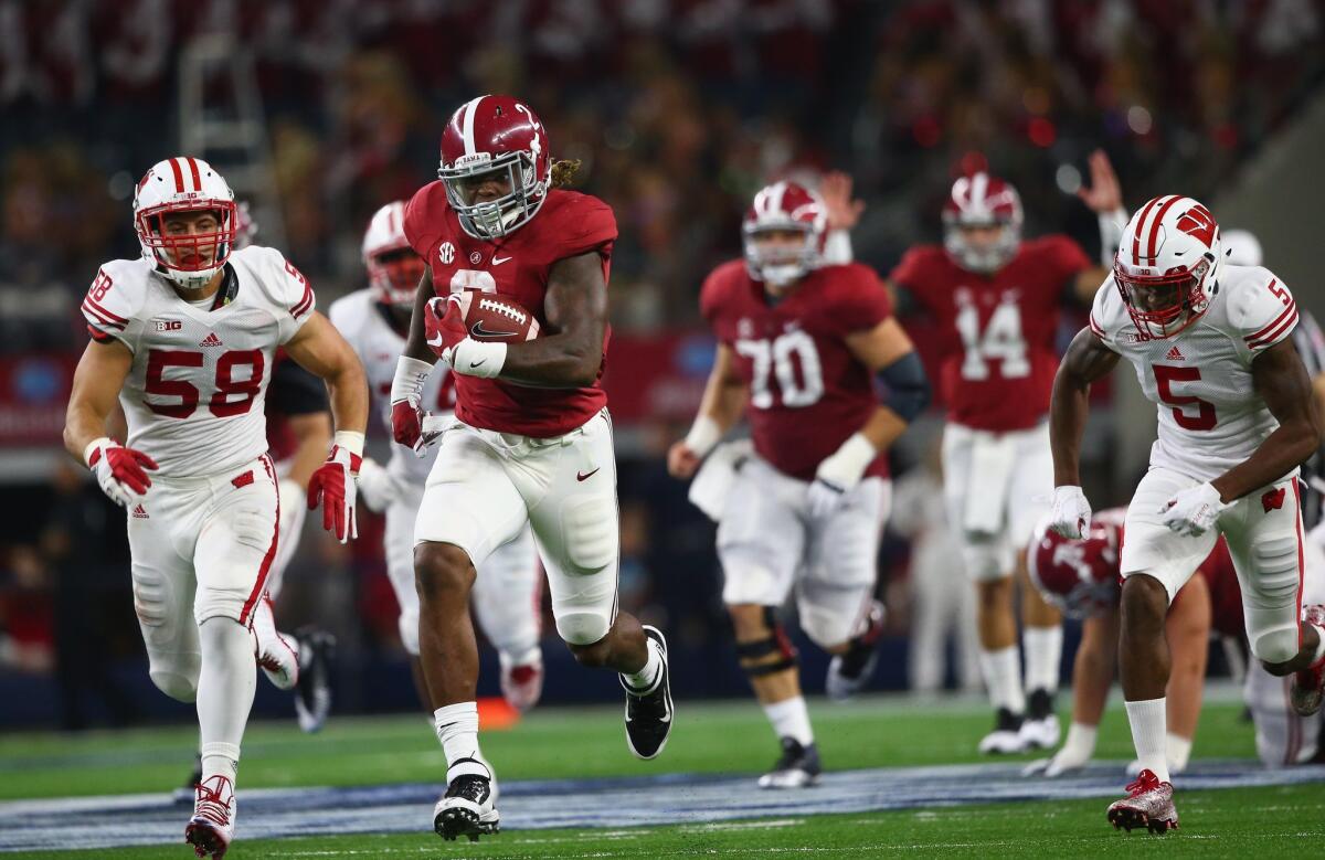 Alabama's Derrick Henry rushes for a touchdown against Wisconsin on Saturday night.