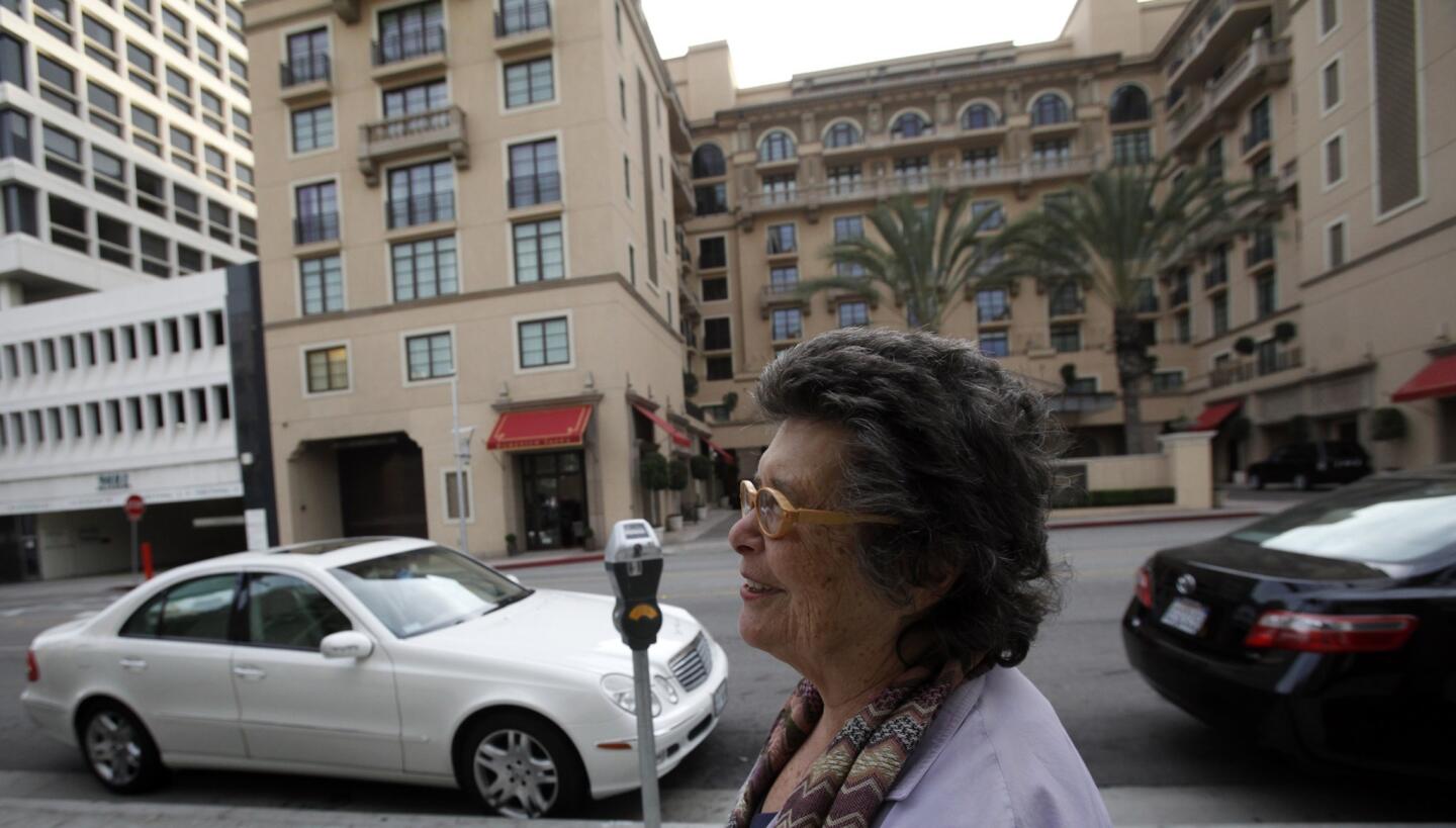 Shari Able, a resident of HUD housing in Beverly Hills, walks in the neighborhood near her small studio apartment. The gleaming shops of Rodeo Drive are a brisk walk away. She said her federally subsidized apartment costs her roughly $200 a month.