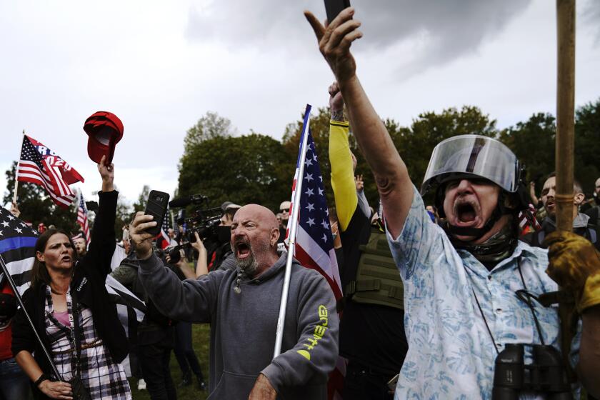 Members of the Proud Boys and other right-wing demonstrators rally on Saturday, in Portland, Ore. 