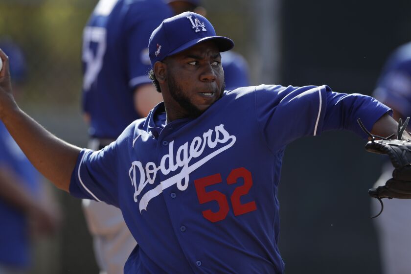 Los Angeles Dodgers relief pitcher Pedro Baez throws during spring training basebal.
