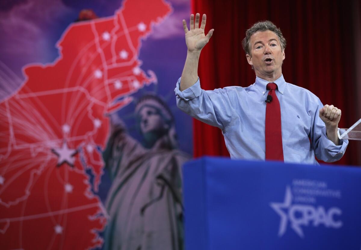 Sen. Rand Paul (R-Ky.) addresses the 42nd annual Conservative Political Action Conference on Friday. He won the event's straw poll on Saturday.