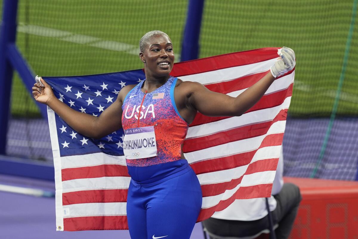 Annette Nneka Echikunwoke, of the United States, celebrates winning the silver medal in the women's hammer throw