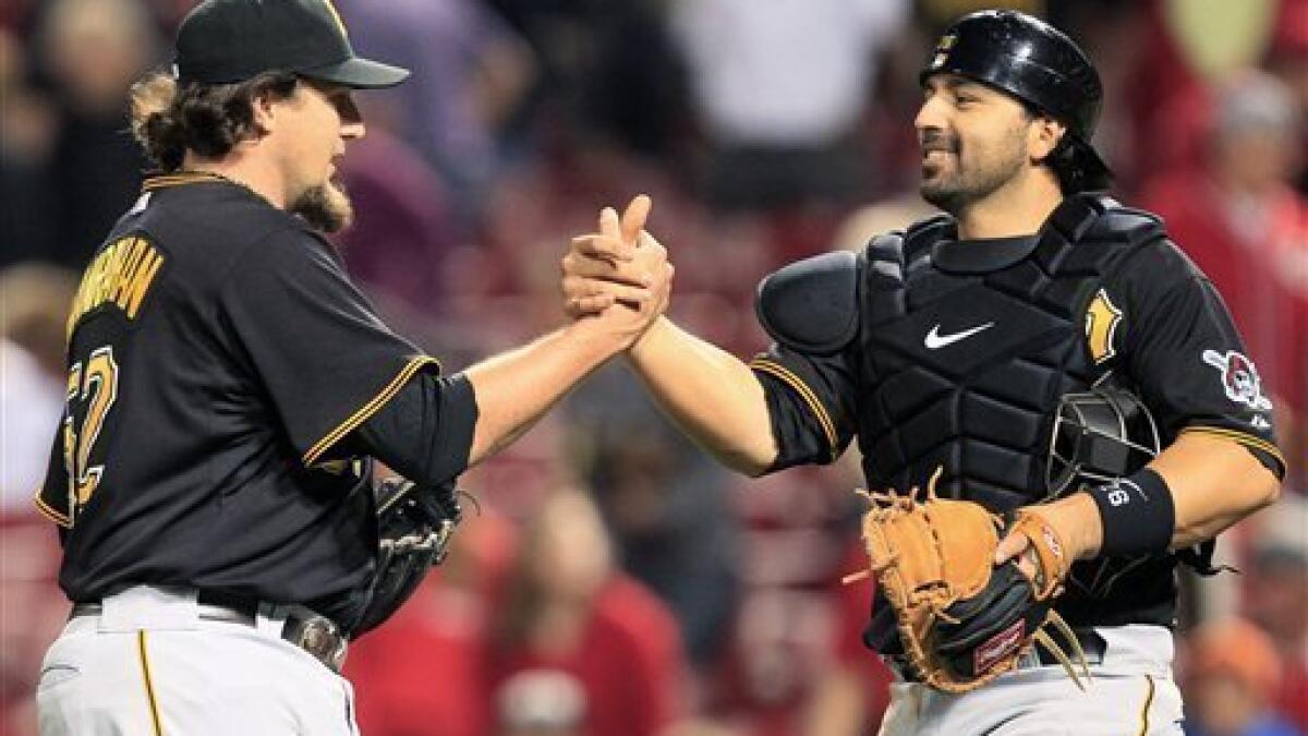Pittsburgh Pirates' Xavier Nady, left, is congratulated by manager