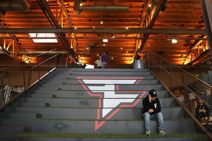 LOS ANGELES-CA - NOVEMBER 16, 2022: FaZe Clan employee Mike Swiv takes a call at Faze Clan's headquarters in Los Angeles on Wednesday, November 16, 2022. (Christina House / Los Angeles Times)
