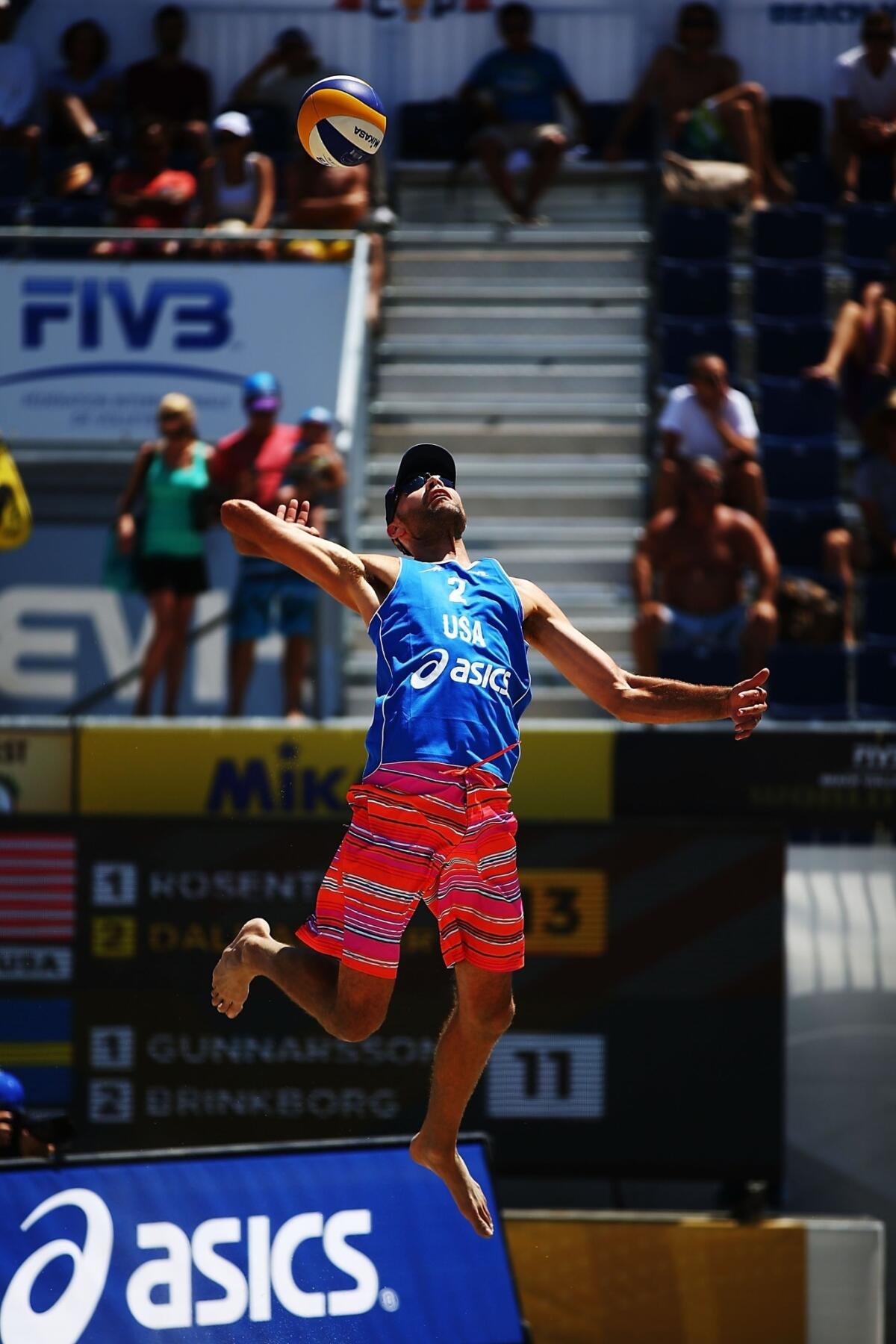 Phil Dalhausser serves during a pool-play match at the FIVB Grand Slam tournament in Long Beach on Wednesday.