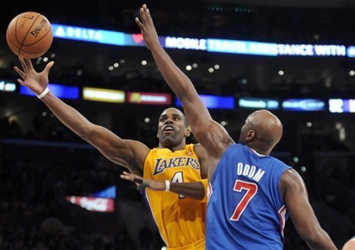 Los Angeles Lakers forward Antawn Jamison (4) gets a shot off over Los Angeles Clippers forward Lamar Odom (7) in the first half of an NBA basketball game, Friday, Nov. 2, 2012, in Los Angeles.(AP Photo/Gus Ruelas)