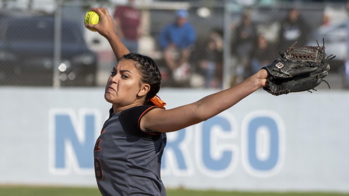 Huntington Beach's Grace Uribe pitches during a CIF Southern Section Division 1 quarterfinal playoff game against Norco on May 24, 2018.