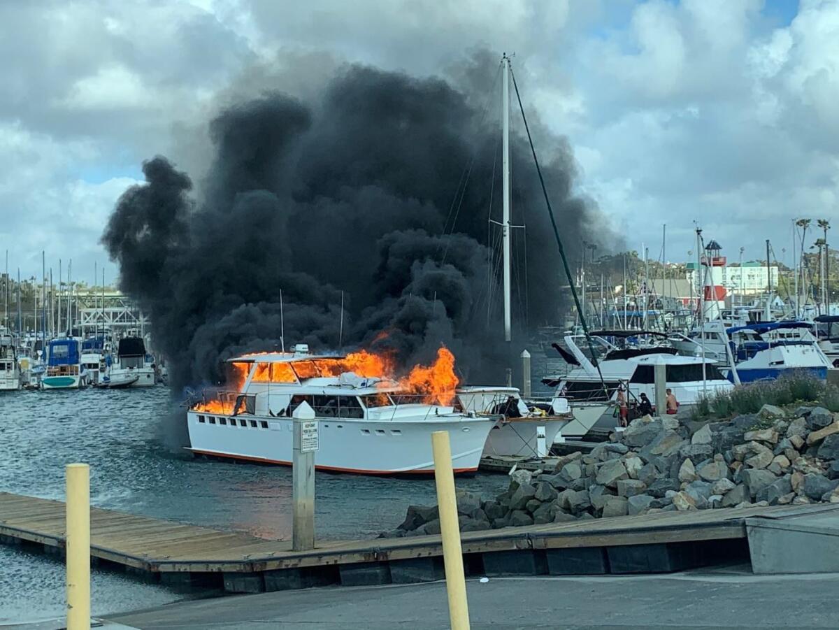Two boats caught fire Monday afternoon at the Oceanside harbor. One was destroyed and the other was severely damaged.