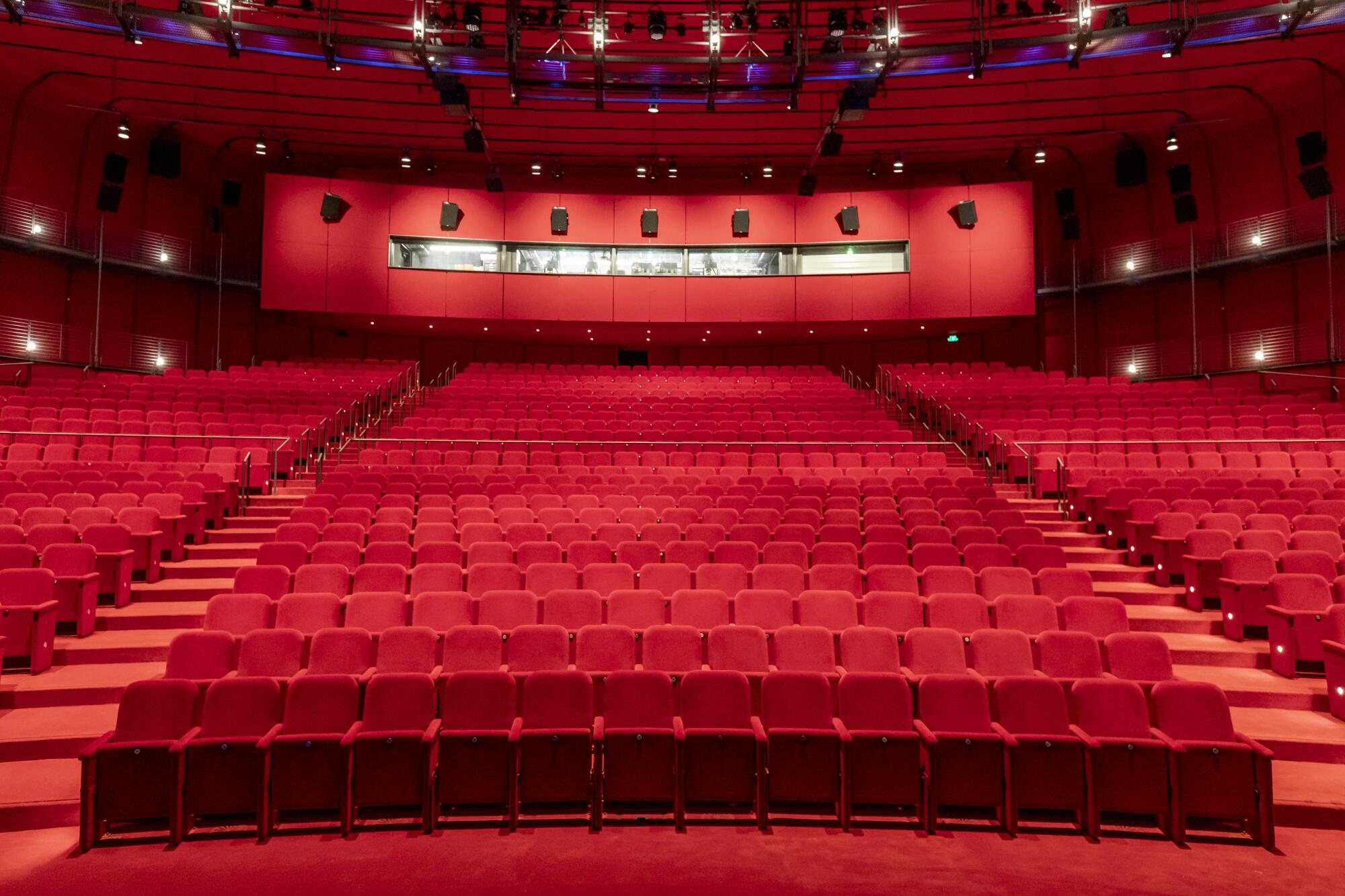 The David Geffen Theater at the new Academy Museum of Motion Pictures is a sea of red — red seats, red floor, red walls. 