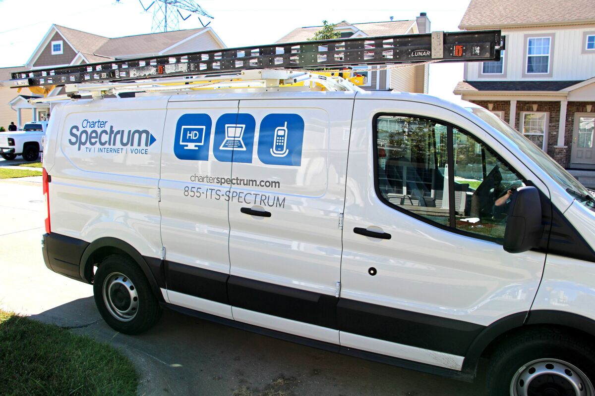 A Charter Communications installer truck. Charter cable TV, phone and Internet service is sold under the Spectrum brand.