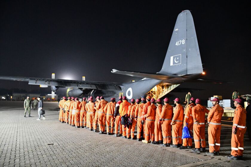 In this photo released by Inter Services Public Relations, Pakistan Army's Urban Search and Rescue team members board a plane for the departure to Turkey to help rescue operation in earthquake hit areas, at Nur Khan airbase in Rawalpindi, Pakistan, Tuesday, Feb. 7, 2023. (Inter Services Public Relations vis AP)