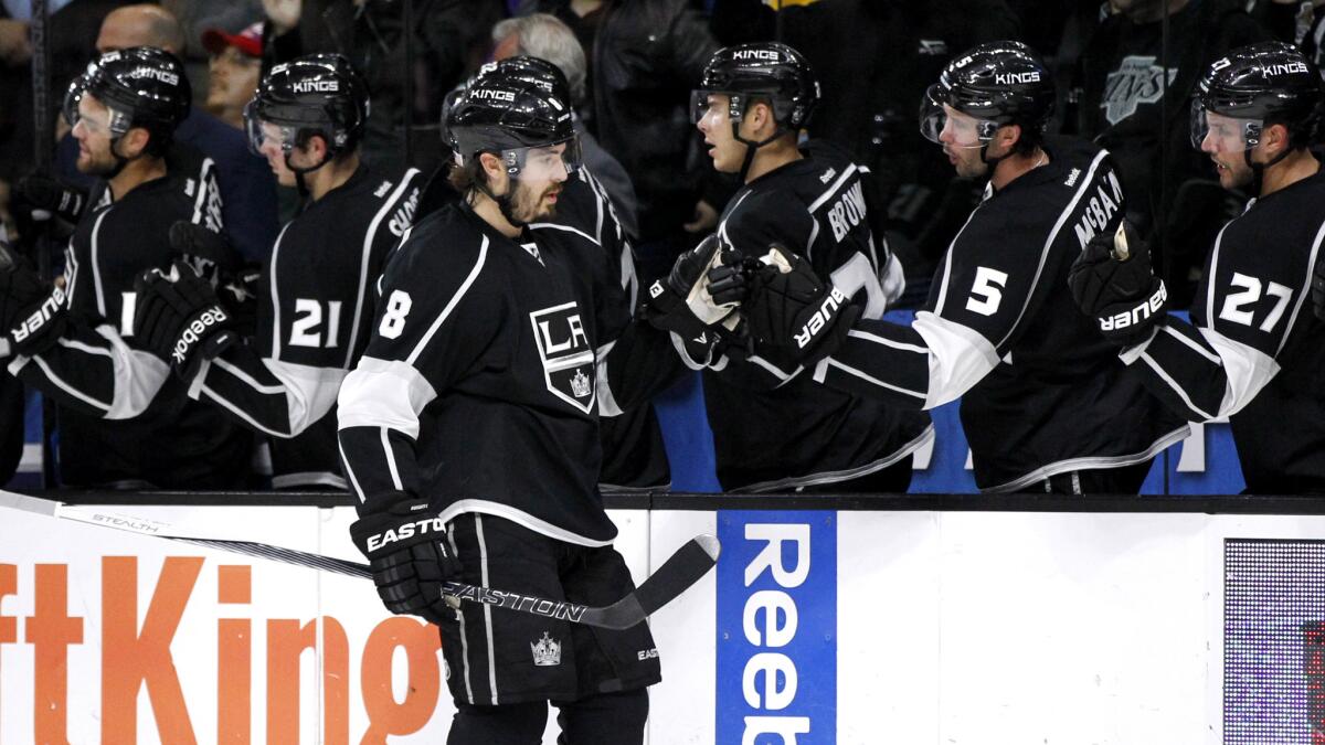 Kings defenseman Drew Doughty (8) is congratulated by teammates after scoring against the Islanders in the first period Thursday night.