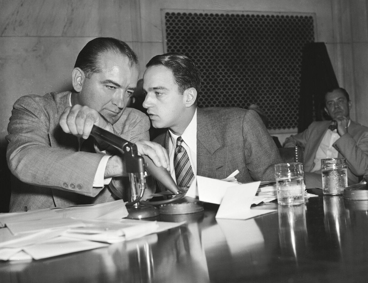Sen. Joseph McCarthy and Roy Cohn confer in "Where's My Roy Cohn?"