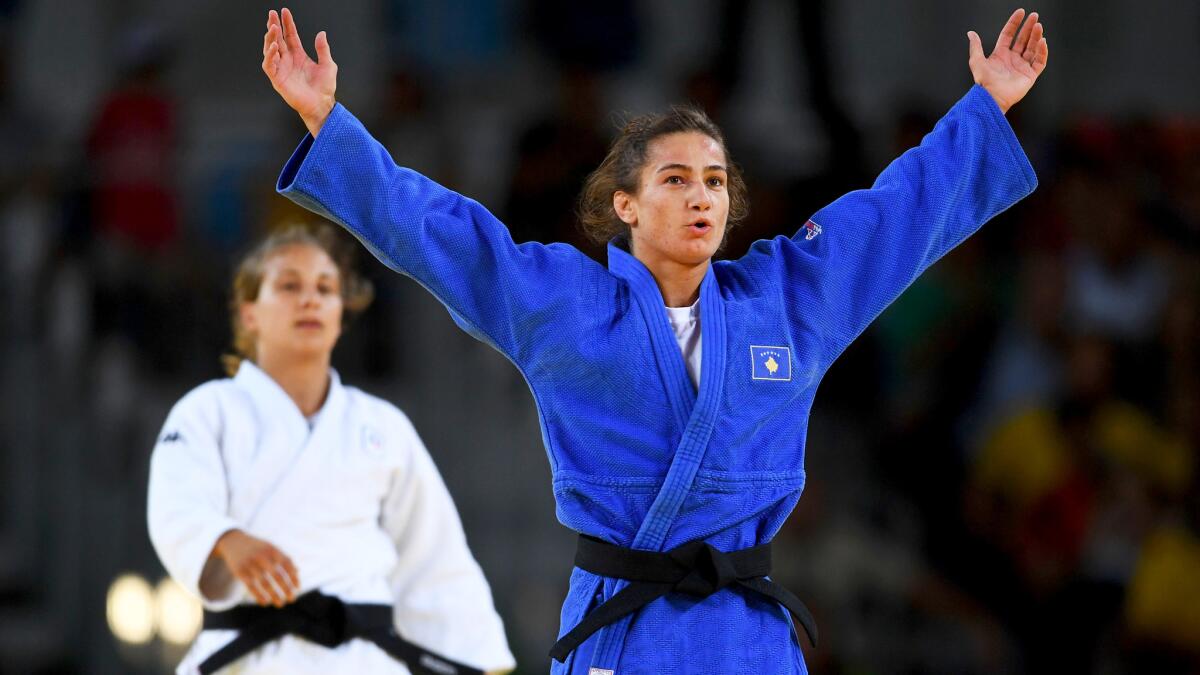Majlinda Kelmendi celebrates after defeating Odette Giuffrida in the women's 52-kilogram judo division on Sunday.