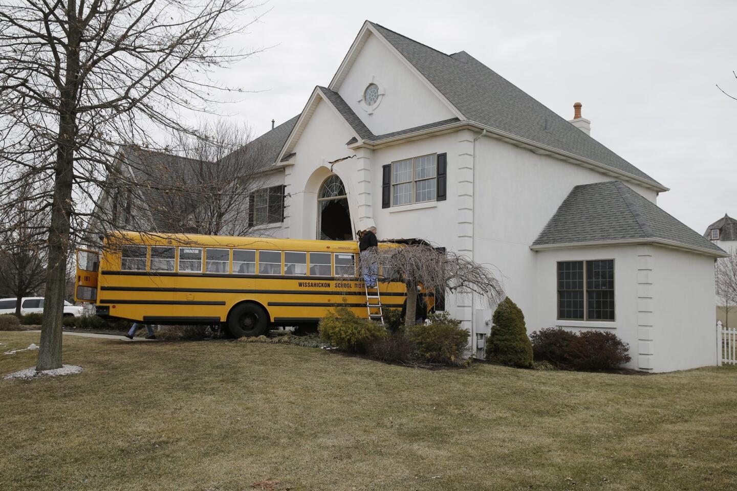 A school bus with nine children aboard crashed into a home in Blue Bell, Pa., Tuesday morning. No one was hurt, including a resident who was home at the time.