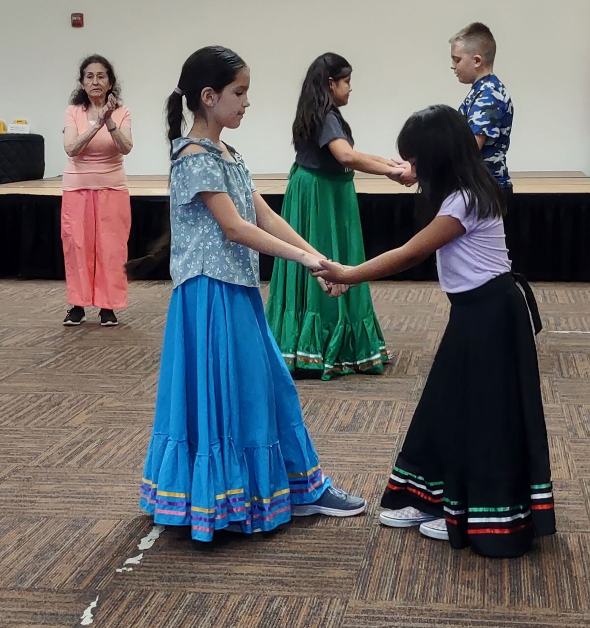 Ballet Folklorico students dance in pairs during a recent rehearsal.