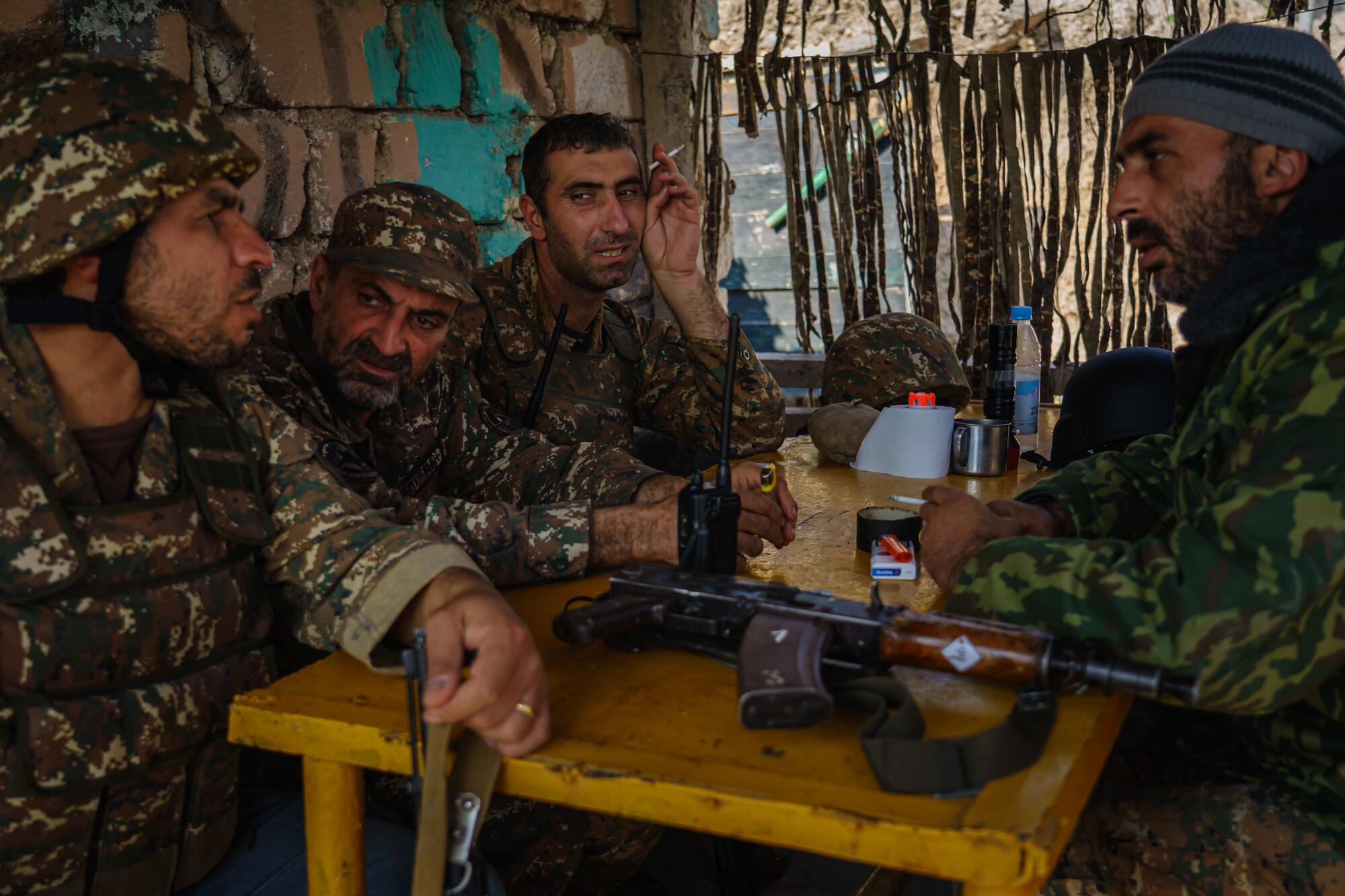 Soldiers spend time together during a coffee break at an outpost outside of Martakert, Nagorno-Karabakh.