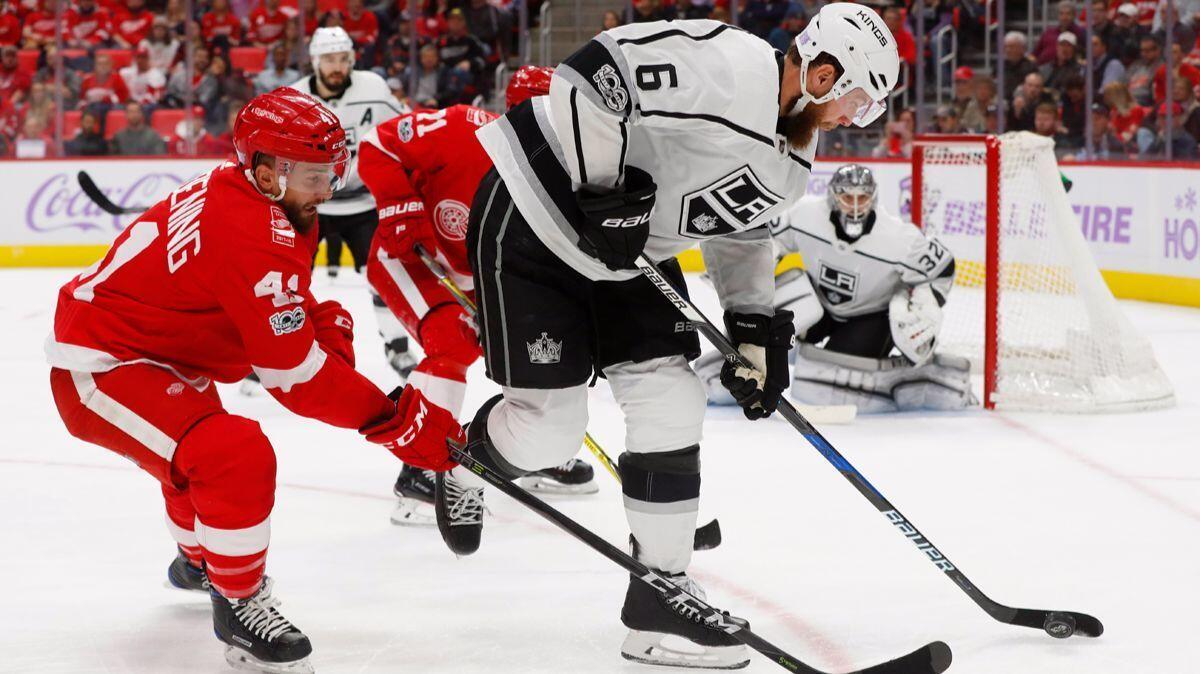 Detroit Red Wings right wing Luke Glendening (41) defends Kings defenseman Jake Muzzin (6) in the second period on Tuesday in Detroit.