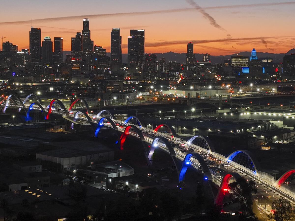 Officials lit the 20 arches on the new 6th Street Viaduct during a ceremony at dusk on Friday. 