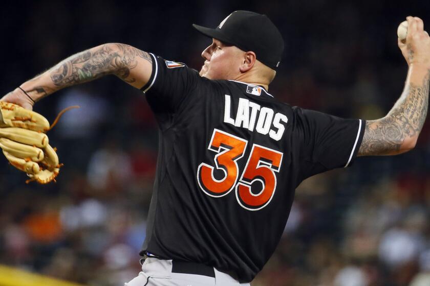 Miami Marlins starter Mat Latos delivers a pitch during a game against the Arizona Diamondbacks on July 21.
